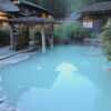 The mixed-bathing outdoor bath at Tsuru no Yu inn in Nyuto Onsen hamlet in the evening